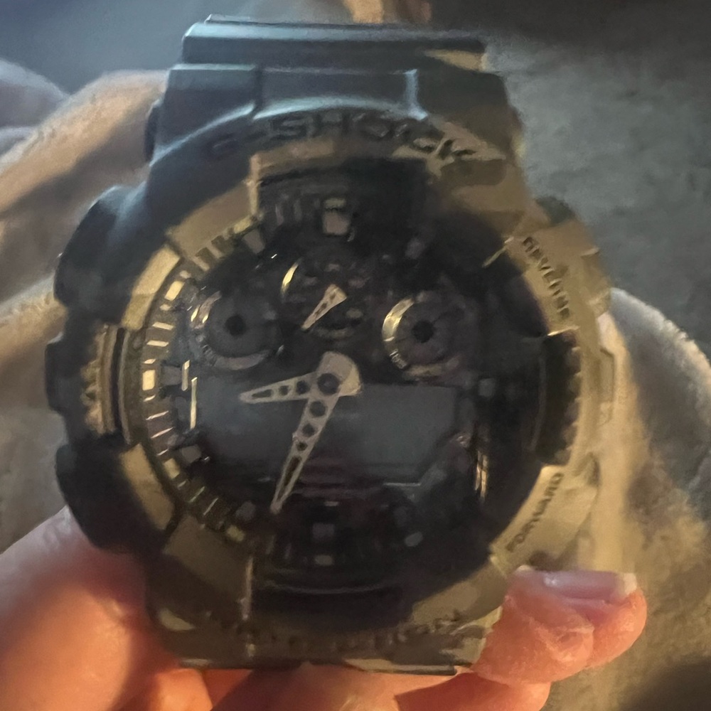 Gray bold designer watch never worn in great condition.